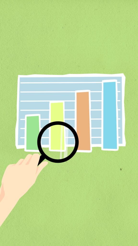 Gráfico financeiro sendo analisado com lupa para acompanhar a aplicação da Regra 50-30-20 no orçamento pessoal.
